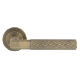 Crown Knurled Lever On Sprung Screw-On Round Rose - Antique Brass